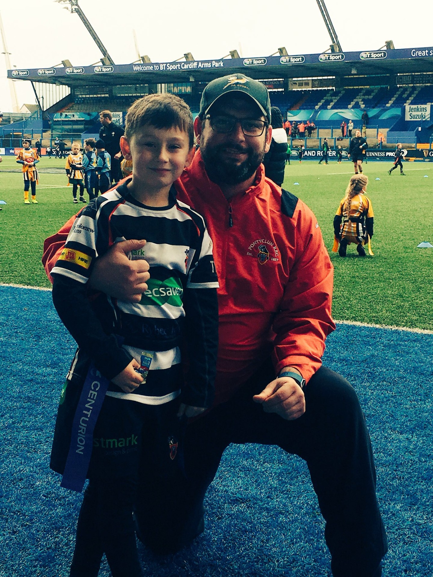 Leon coaching mini rugby with young player