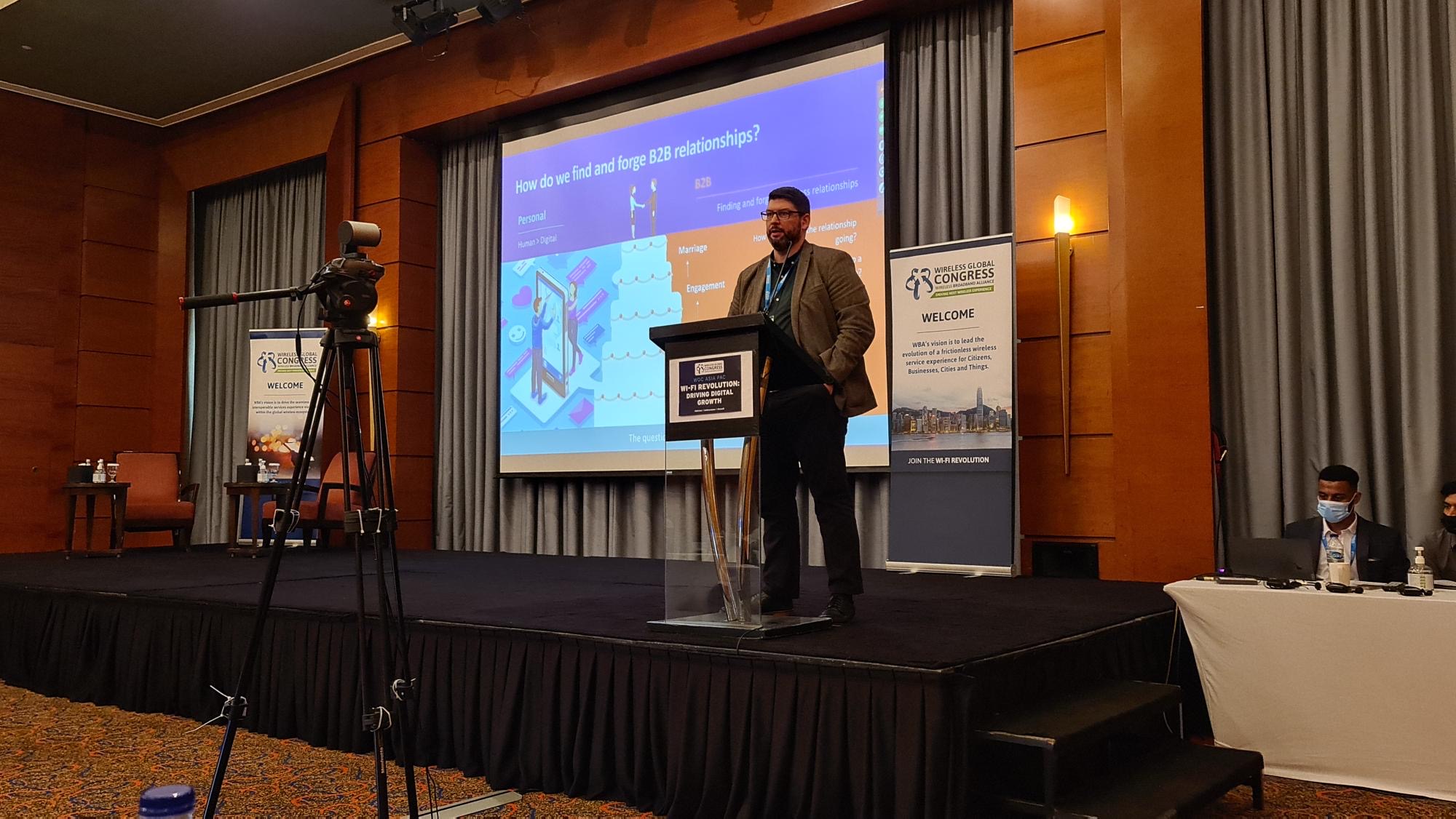 Leon speaking at conference
